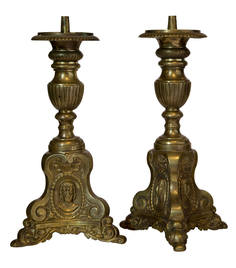 Pair of continental brass candlesticks on triform bases