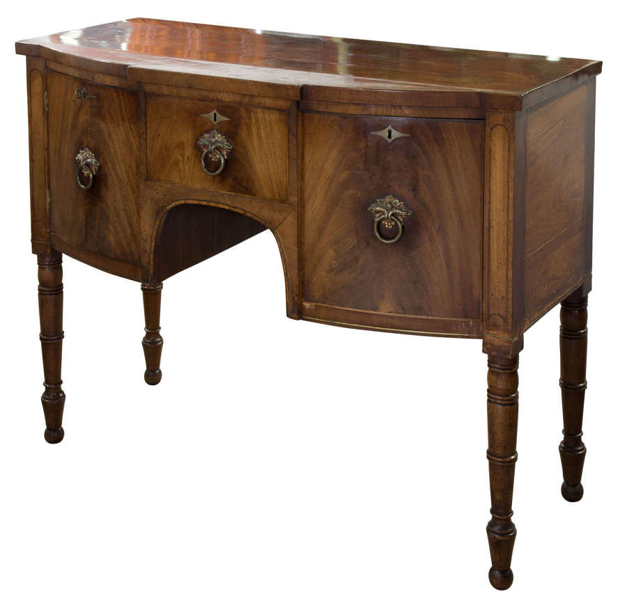 A William IV mahogany bow fronted sideboard