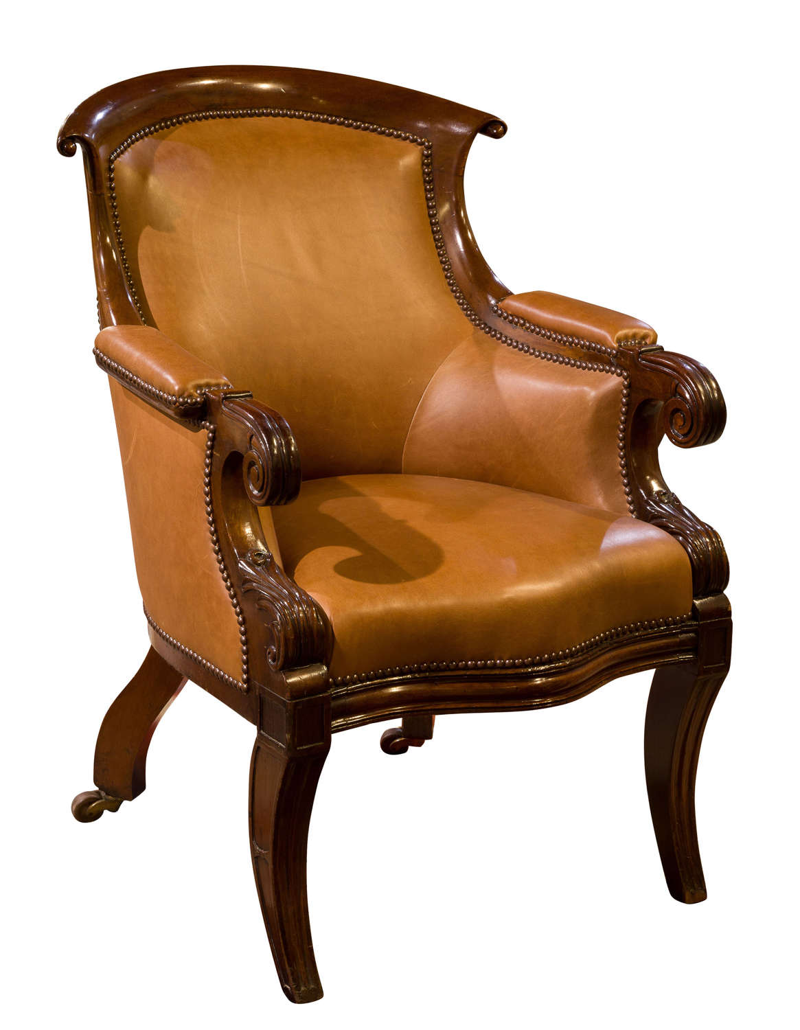A 20thC mahogany Regency style leather upholstered library tub chair