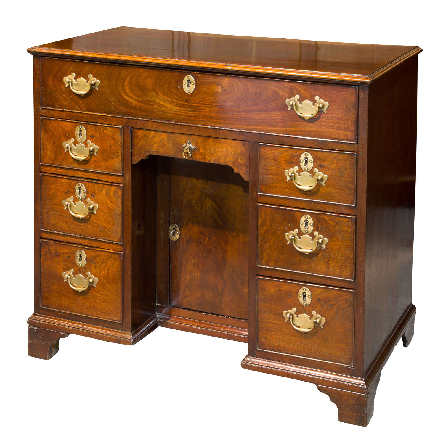 A George III small kneehole desk of six drawers