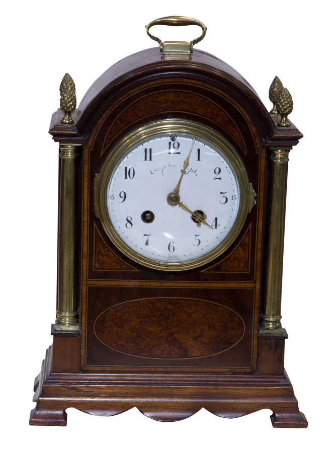 A brass mounted mahogany table clock