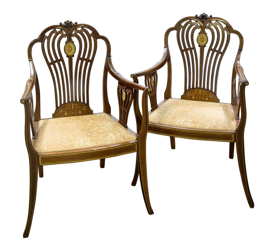 A pair of inlaid mahogany salon chairs