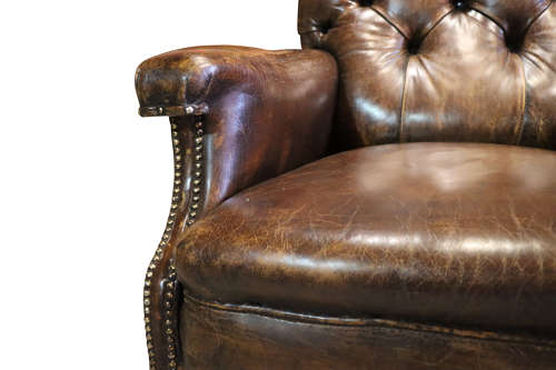 A Leather Armchair by Shoolbred