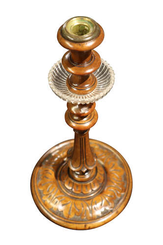A Pair of Carved Walnut Candlesticks