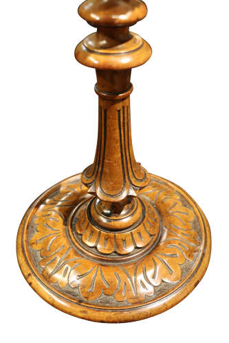 A Pair of Carved Walnut Candlesticks