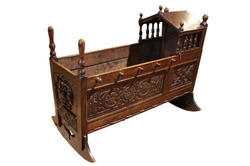 A 17th Century Style Oak Panelled Crib, circa mid-19th century