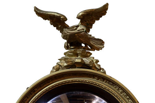 Early 19th Century Regency Circular Convex Giltwood Mirror with Eagle Surmount